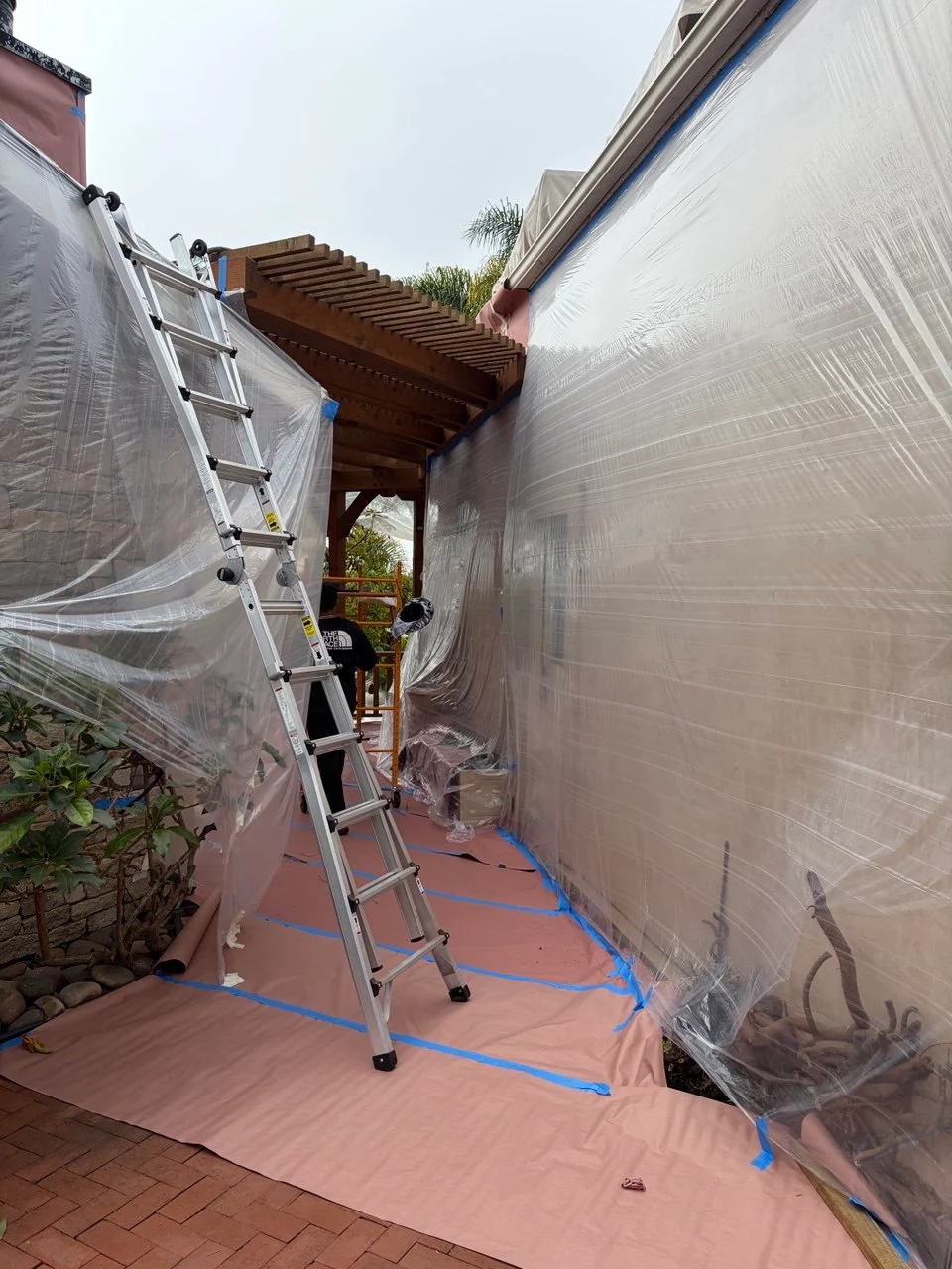 Exterior preparation with ladder and sheeting